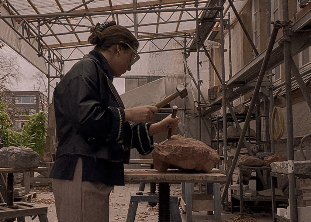 Detail: sculpting at UdK stone workshop.